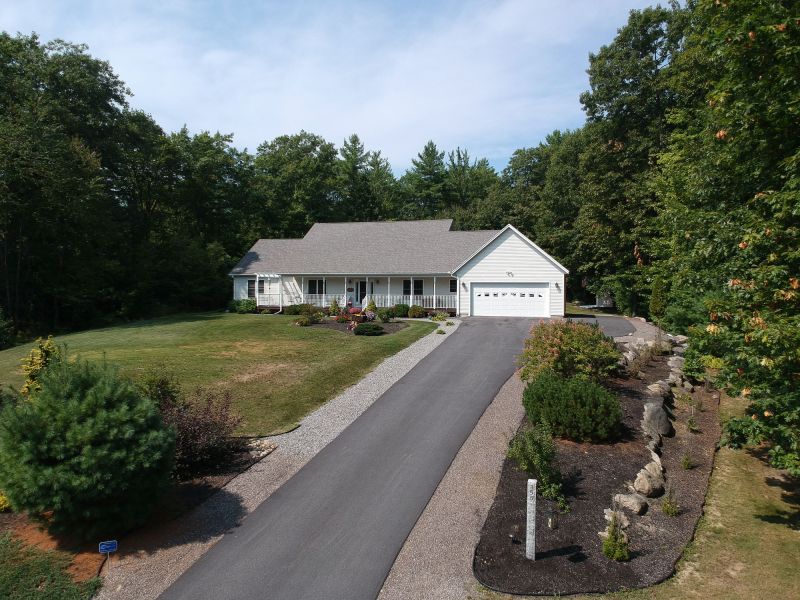 Residential Asphalt Driveway with Landscaping
