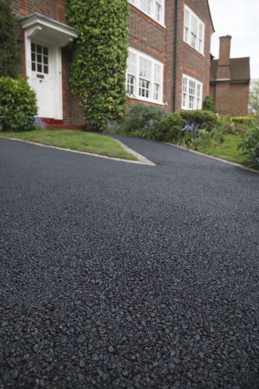 Residential Asphalt Driveway with Landscaping